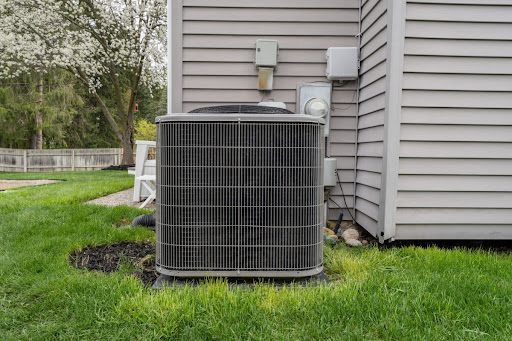 A Central AC Unit Installed Outside Of A House.