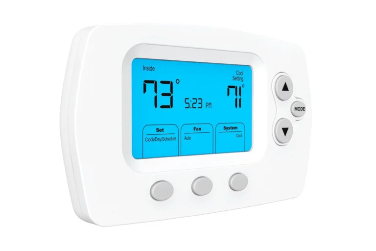 A digital thermostat displays an indoor temperature of 79°F, a cool setting of 71°F, and the time 5:23 PM. The screen is blue with various control buttons.